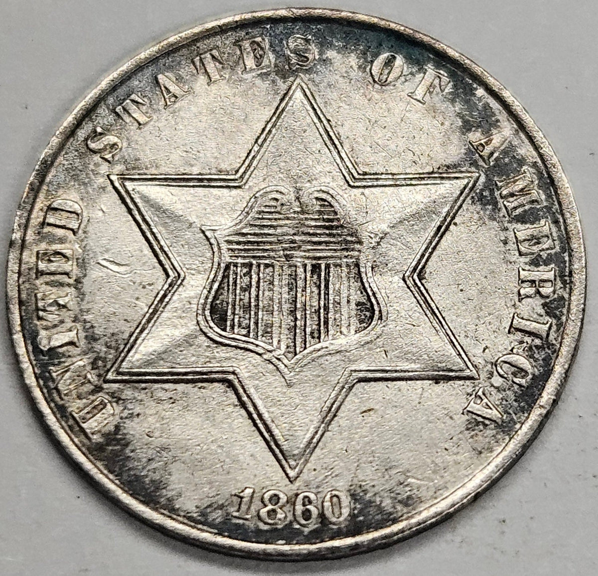 1860 Silver Three Cent Piece . . . . Choice About Uncirculated