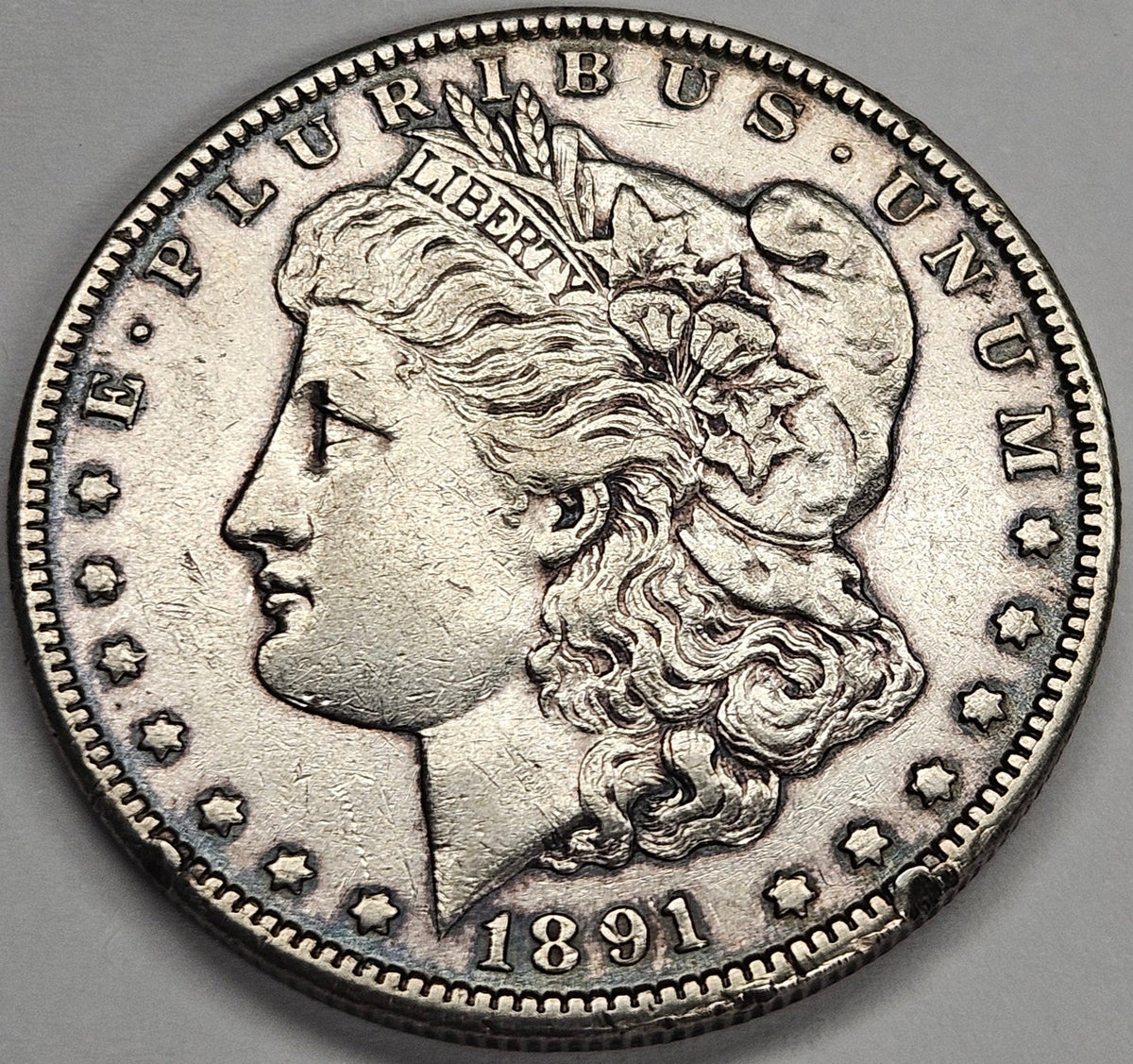1891-CC Morgan Dollar . . . . AU rim hit